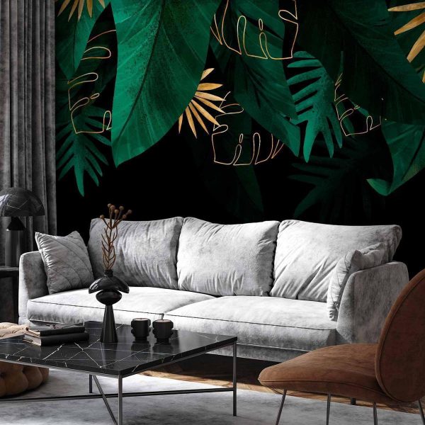 Papier peint - Jungle and composition - motif of green and golden leaves on a black background Papier peint - Jungle and composition - motif of green and golden leaves on a black background