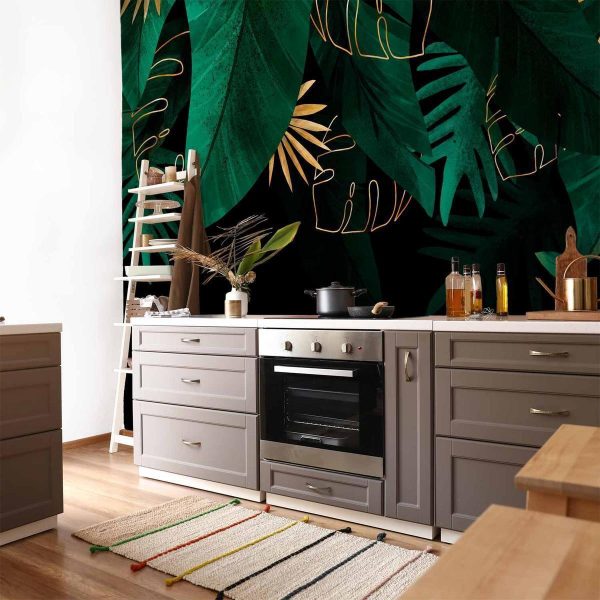 Papier peint - Jungle and composition - motif of green and golden leaves on a black background